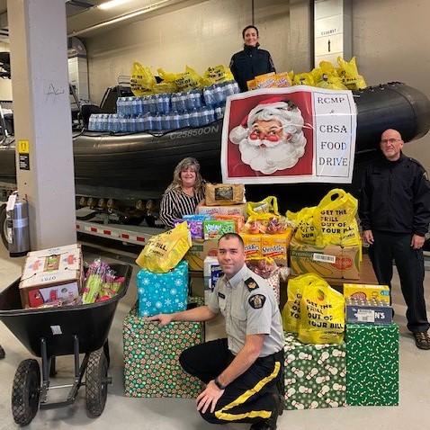 RCMPONT's tweet photo. The holidays can be especially hard for those in need. Members from #RCMP #Cornwall &amp; their @CanBorder partners joined efforts to “Pack a Zodiac” with 4,012lbs of non-perishable food items which were then donated to the Agapè Centre in Cornwall. #CopsDoingMore #CopsWhoCare https://t.co/hENmjWoxWf