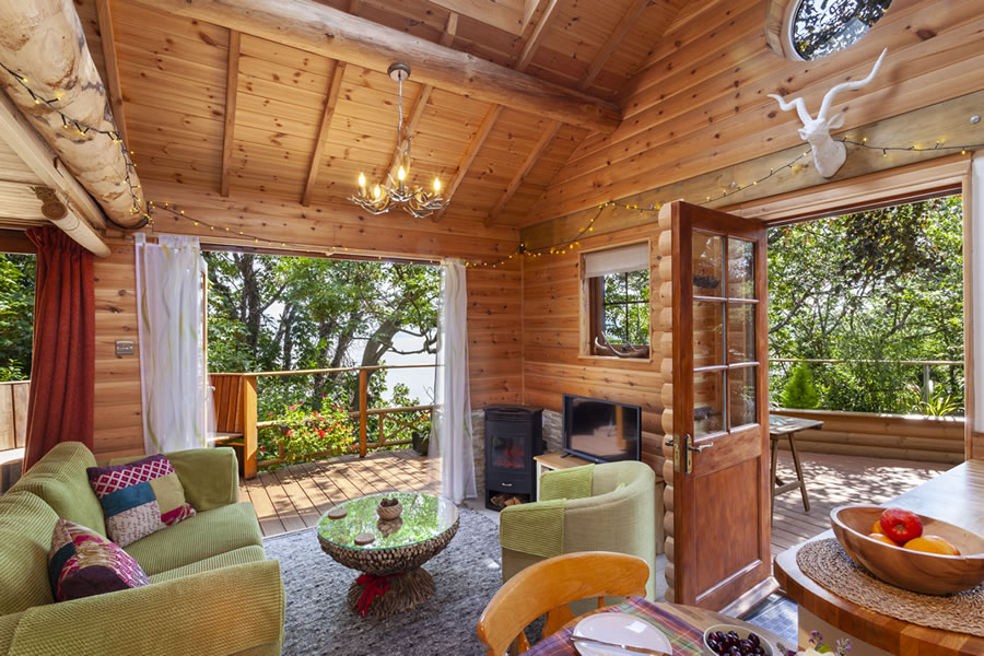 TheHolidayCots's tweet photo. Tucked away in the trees, the romantic Porthole Log Cabin enjoys incredible views from both inside & out! It's the perfect place for couples seeking an idyllic escape.
🛏️ Sleeps 1-2
https://t.co/G6fmNs2KrC
#LogCabin #Minehead #Somerset #RomanticBreak #JustForTwo #SeaViews https://t.co/NhSPH8m7MR