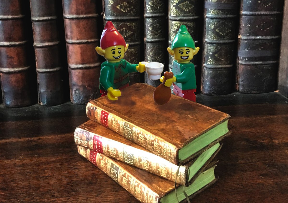 MarshsLibrary's tweet photo. The elves were caught red-handed. 'Food and drink is an absolute no, no, even if it is plastic!' Page said through gritted teeth. 'Cheers!' Buckmark replied. #NoFoodAndDrinkInTheLibrary #MarshsElves #ElfMischief https://t.co/e3ky96Zoxt