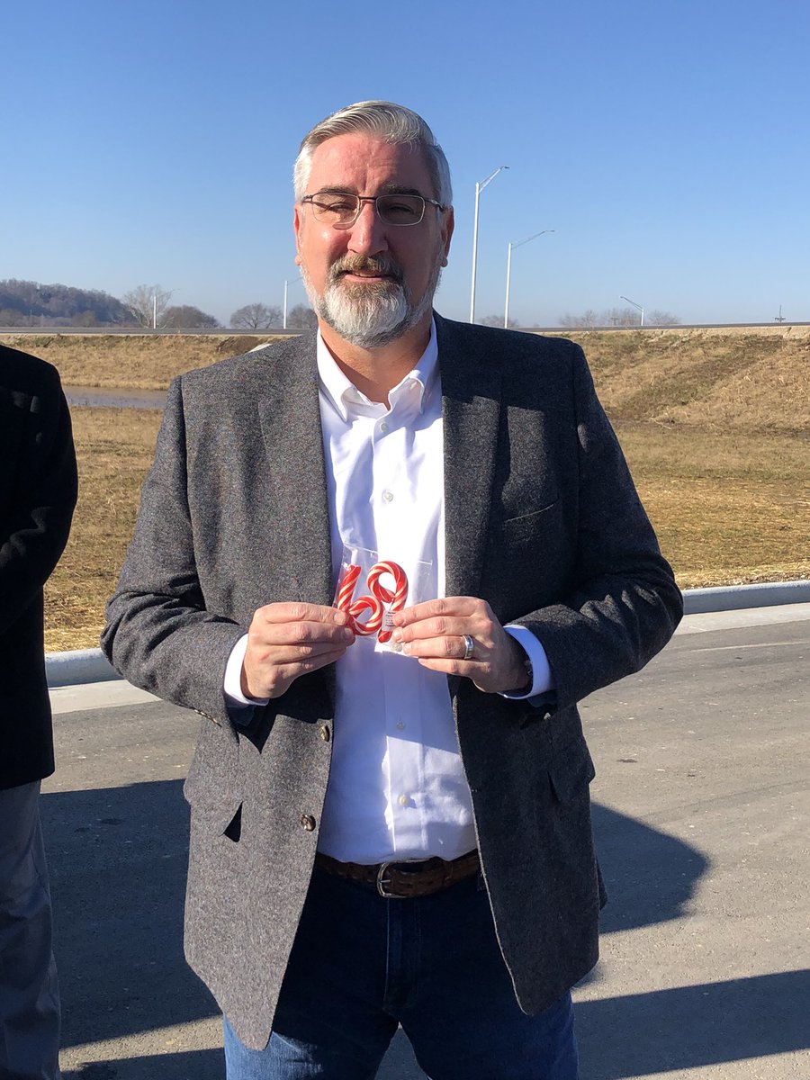 ByMitchLegan's tweet image. Gov. Eric Holcomb celebrates opening Martinsville’s northbound section of I-69 with special candy canes from the Martinsville Candy Kitchen