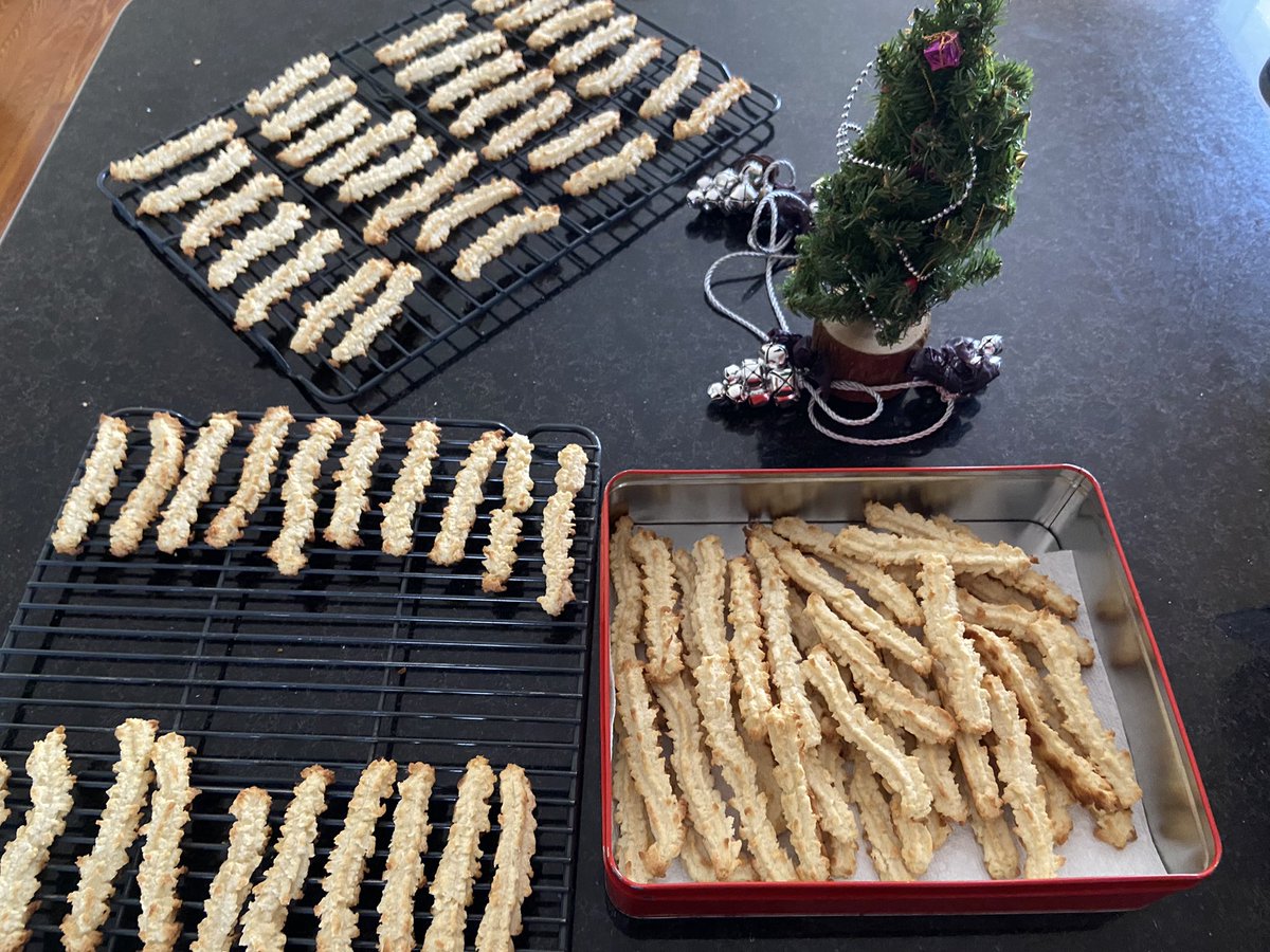 It is the season 😋😋😋. My wife started to bake her delicious coconut spritz cookies. (Spritz Cookies are cookies traditionally prepared at Christmas in the East of France, and Germany.)