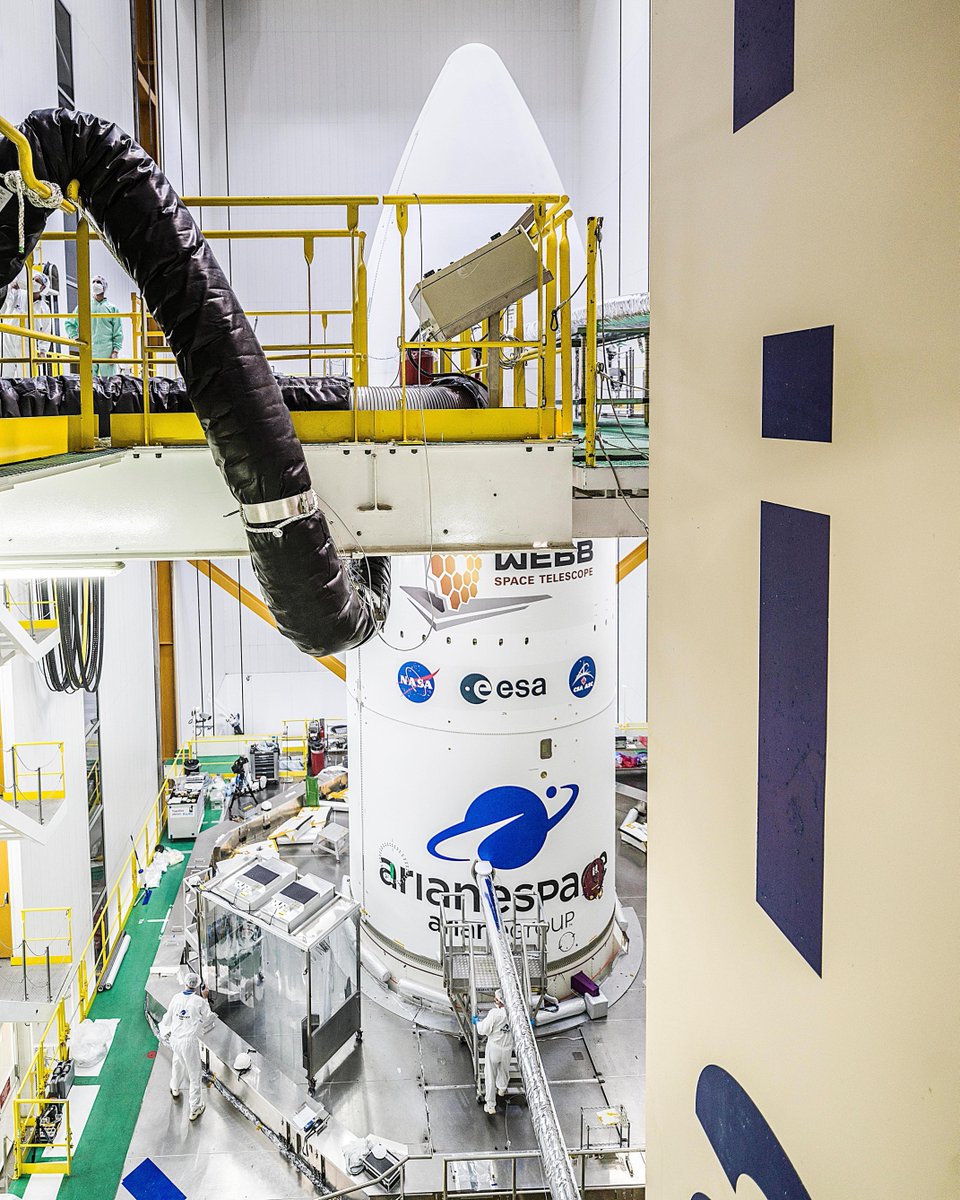 The James Webb Space Telescope is enclosed inside its rocket fairing.