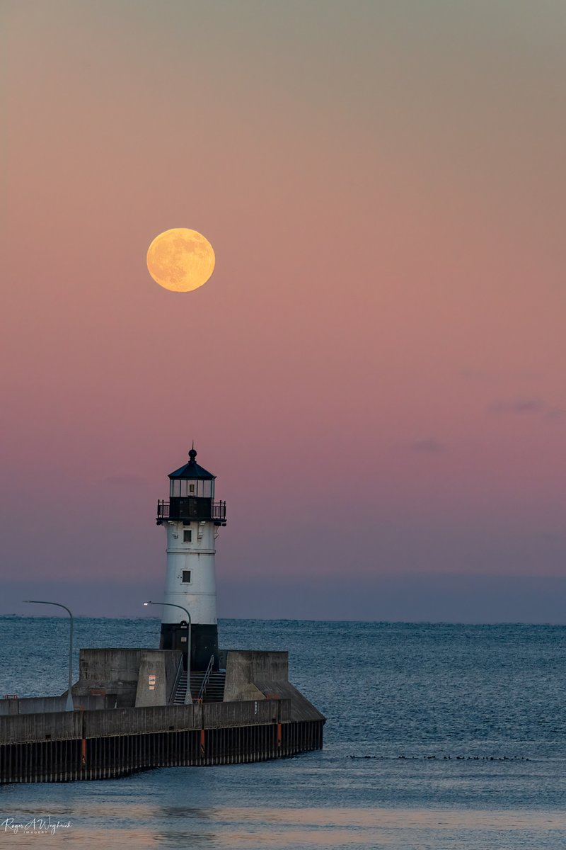 Full moon rise within minutes of sunset at the Port of Duluth.