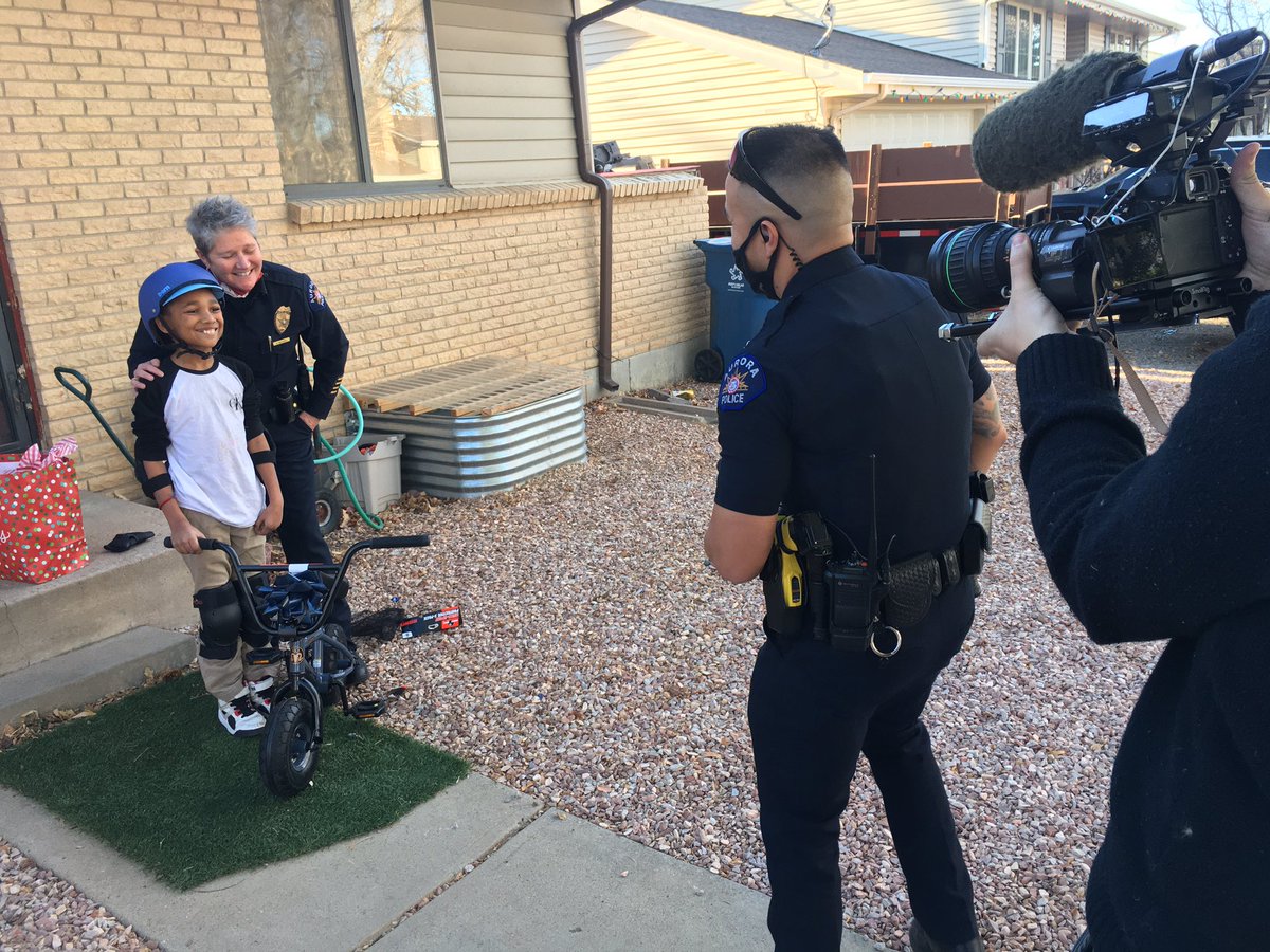 greg_nieto's tweet image. Paying it Forward! @AuroraPD Chief Vanessa Wilson presents new bike to Chassyon. 10-year-old donated $200 in chore $$ to buy #Christmas gifts for needy kids! @channel2kwgn @KDVR
