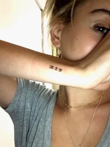fetusbaldwin's tweet photo. her tattoo https://t.co/IbnomsTeam