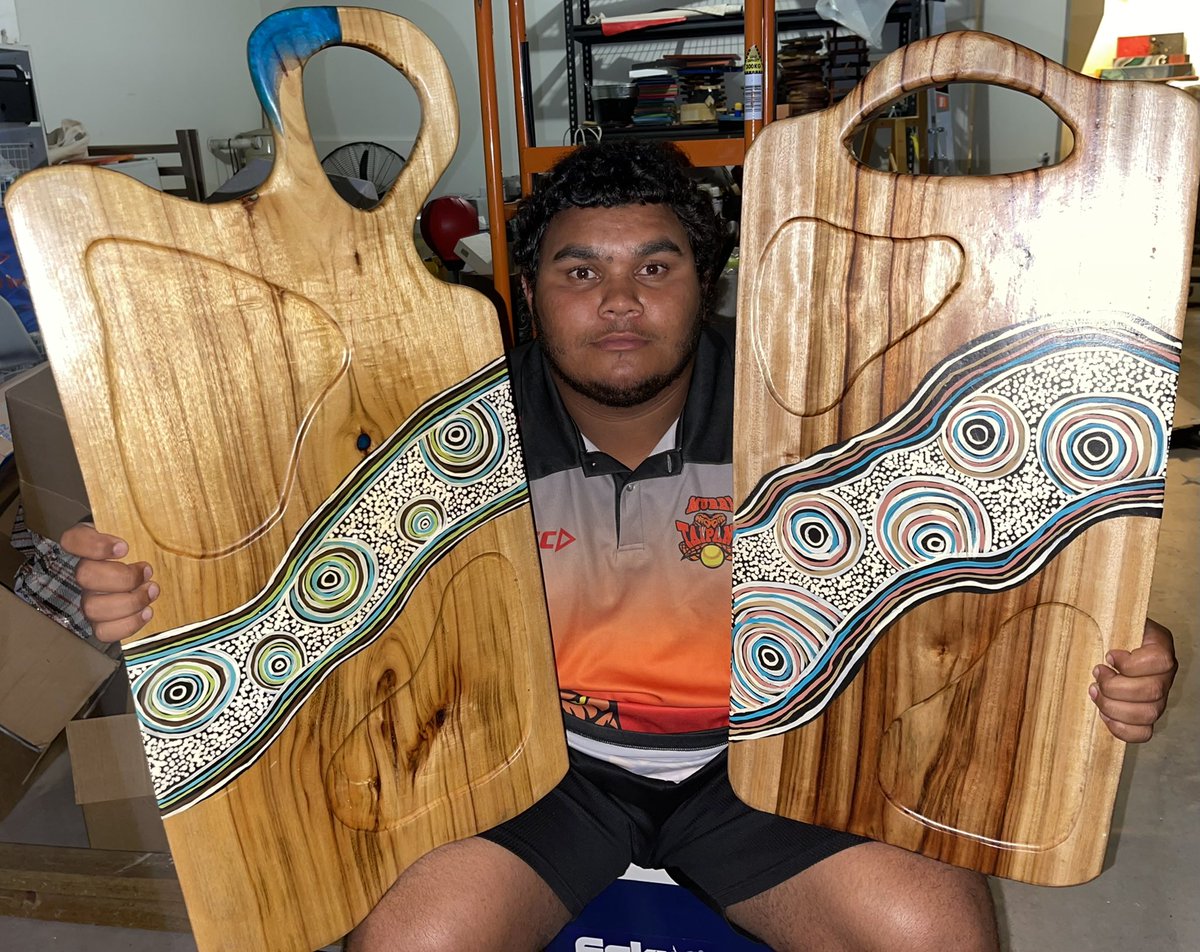 Son Jak holding the deadly hand made platters for Fig Jam &amp; Co in Ipswich Qld