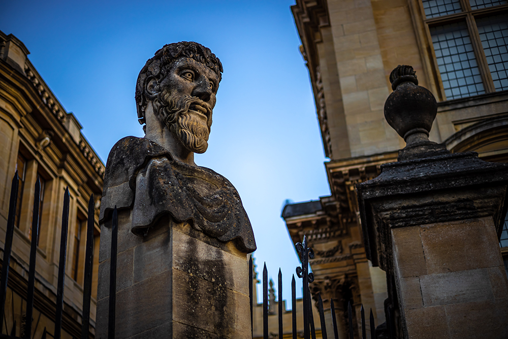 A stone bust outside of an Oxford building