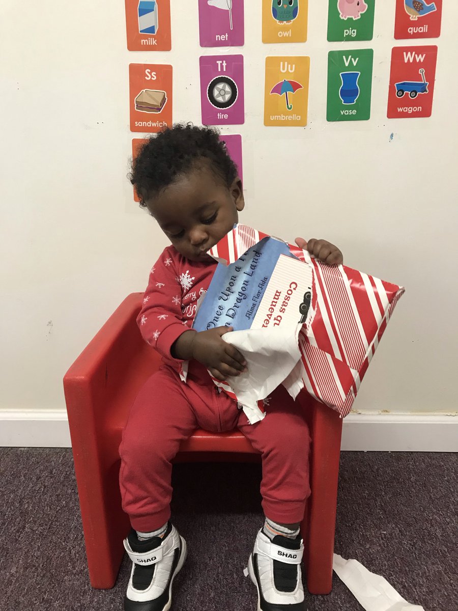 Look at these pictures of the Young Toddler class! I love seeing happiness and joy on their faces. #book #bookexchange #christmas2021 #daycare #childcare #Christmas #pajamaday #openingpresents #toddler #lovingschool
