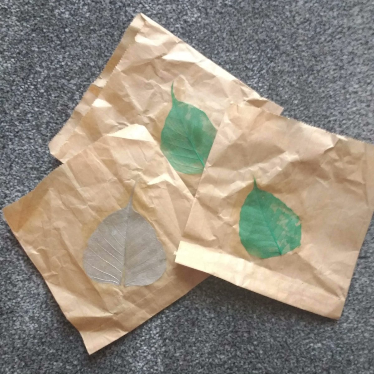 SkeletonLeafJTL's tweet photo. Some final gift wrapping - upcycling some small brown paper bags with skeleton leaves for stocking fillers https://t.co/oyJweQCU2u