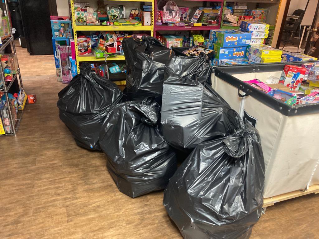 Those aren’t bags of trash! Instead, they are holiday gifts for our children, donated by wonderful organizations from across our state of Florida. We are grateful for the support. Happy holidays!