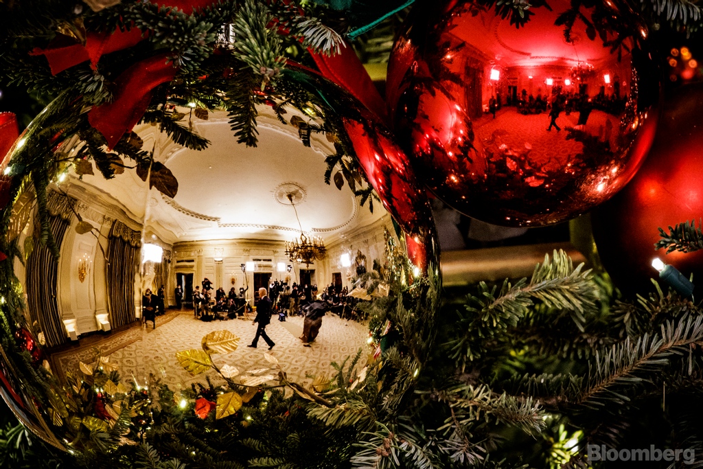 President <a href="/JoeBiden/">Joe Biden</a> is reflected in Christmas tree decorations as he leaves the podium after speaking on Covid-19 and the omicron variant at the White House in Washington, DC, on Dec 21, 2021.

(📸 by Samuel Corum/Bloomberg)

#onassignment #photojournalism #biden #covid19 @potus