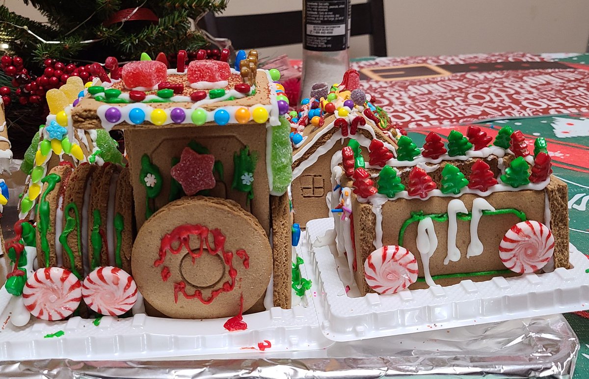 blueburby1's tweet photo. Very carefully following the instructions for gingerbread train assembly 🤣! 
It was Christmas activities with my kid this afternoon... He only wanted to help with the candy decorating part. 
#christmas #gingerbreadhouse #christmasdecor #gingerbreadtrain #candy #familytime https://t.co/jxME63tmt2