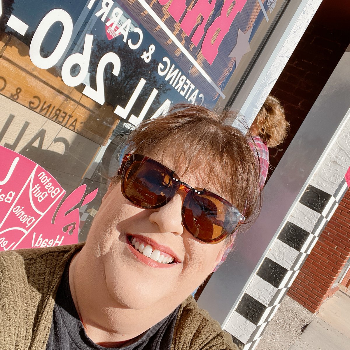 Why is this woman so dang happy? She's been doing marketing for @delanobbqco  for years - a job made easier by these snazzy windows designed by the Delano Barbeque team (they've got mad skills beyond the amazing bbq, it seems) and installed in 2014 by us.
