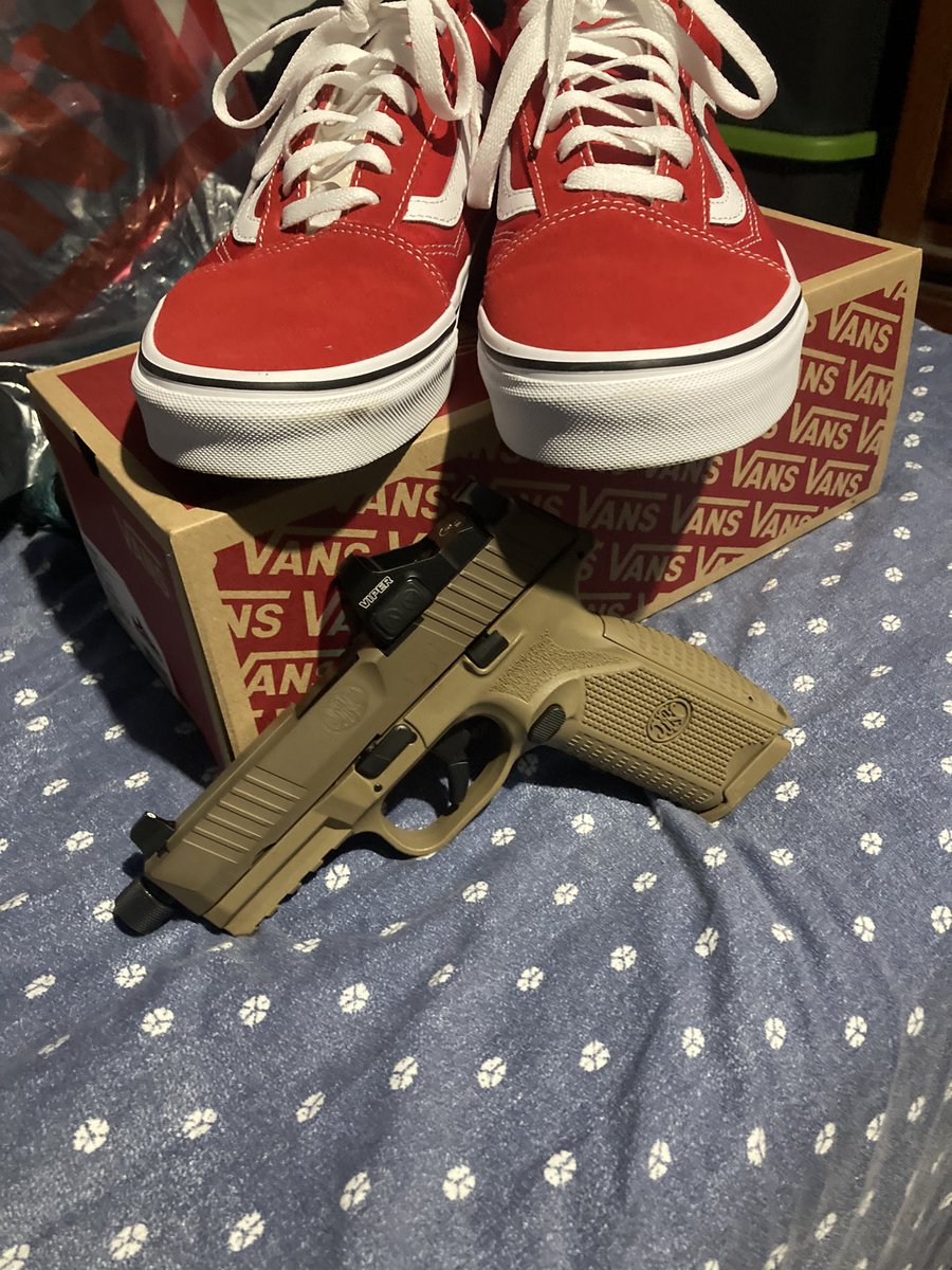 The 1911 Kimber with the red Vans or the FN509 with the vans