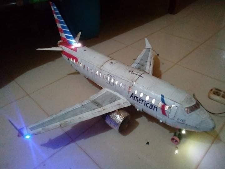 Suhaib252's tweet photo. American Airlines, you have a big fan in Sudan. Khalafallh Ahmed is a high school student who’s passionate about building airplane models out of wood and scrap metal. He spent long days and nights building this beautiful model of an Airbus carrying your livery. His attention to https://t.co/cersvwnjJp