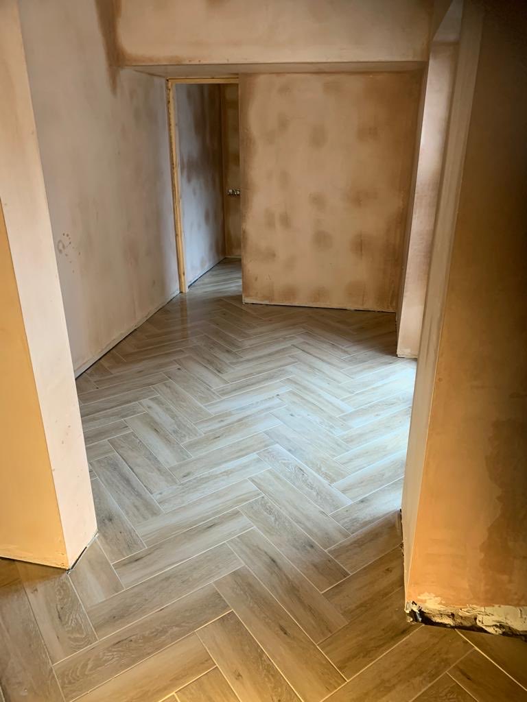 Last job of the year completed! Herronbone pattern Wood effect plank tiles bedded onto anti crack Matt so they’ll be no issues with grout cracking in the future ! Looks 🔥!