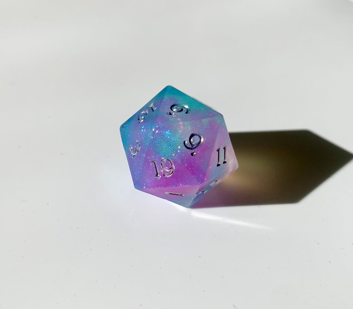 RpgrsD's tweet photo. Let's do another #dice giveaway! These handcrafted dice are one of my favorite sets to date. The colors were inspired by the Orion Nebula. The numbers are detailed in liquid chrome paint #dnd #ttrpg #pathfinder #starfinder #TTRPGs #dnd5e 

To Enter:
❤️ Like
➡️ Follow &amp;
🔃 Retweet https://t.co/Lxh00GdyOA