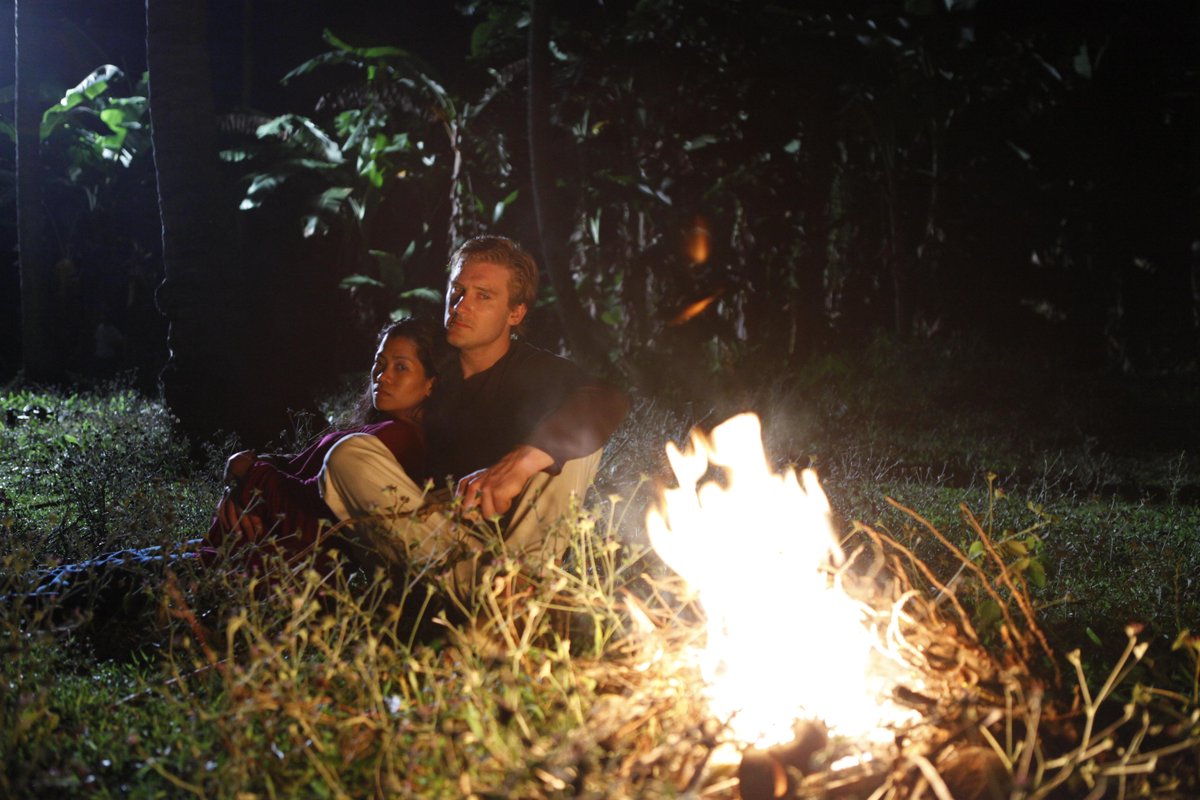 Reenactment: David and Cynthia cuddle outside in the jungle in front of a small fire while hiding from killers hired by her ex-husband.  #BestofNatGeo continues today on National Geographic. #LockedUpAbroad