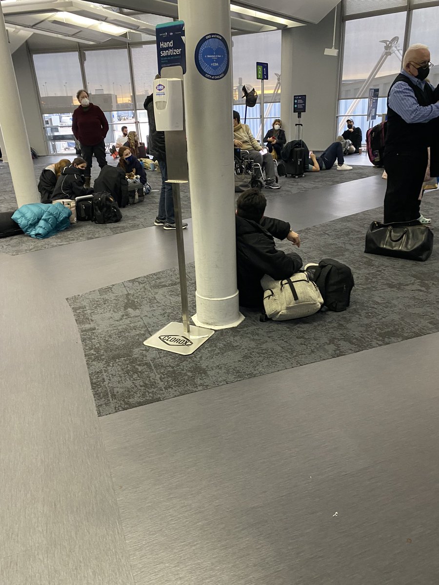 DomainsVvs's tweet photo. No seating at this gate, feelin like a hurricane feema camp in dis bitch, at least let us get some of those tin foil lookin blankets and sum MREs to complete the vibe https://t.co/rJfj8oHMGX
