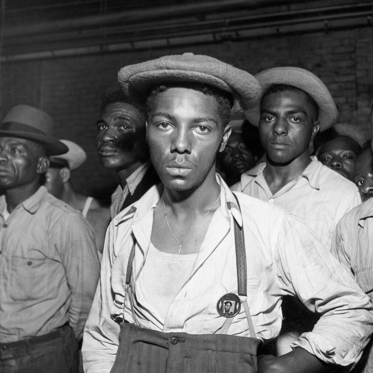 Black American men are rounded up after wartime race riots between blacks a...