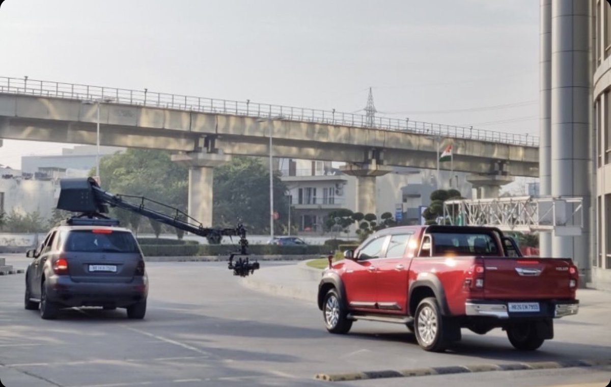SirishChandran's tweet photo. Looks like the #Hilux will finally arrive in India

Got this in my DMs, while being shot for TVC (also, why is it being shot in Cyber City and not in the mountains / desert / jungle with an ADV strapped into the load bay?)

Excited? And what do you think it should be priced at? https://t.co/NW7NJvCUbV