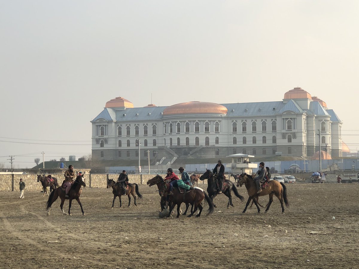 SecKermani's tweet photo. A buzkashi practise match in the shadow of the Dar ul Aman Palace in Kabul 

Interesting chatting to the mix of spectators including students, labourers, former Govt officials &amp; young Talibs 

w/ @AFZhwak 

📸 @gpjhill https://t.co/VyTKBBjsYm