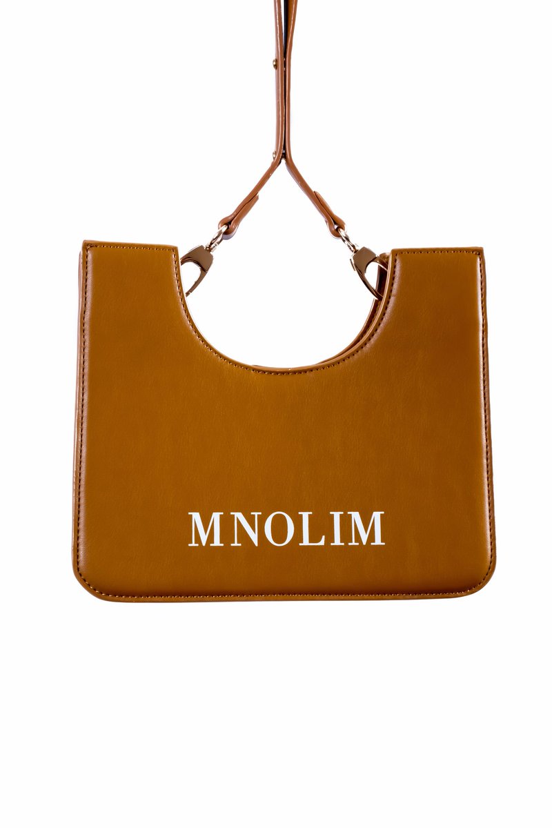 mattenolim's tweet photo. Matte Nolim 
Makhwapheni Bag Color 2 
The cut out designs function is for bag security and comfort, so bag can fit like a puzzle underneath wearers arm, strap is now removable or can be tucked into bag for bag purse mode. https://t.co/arfalWzKhb