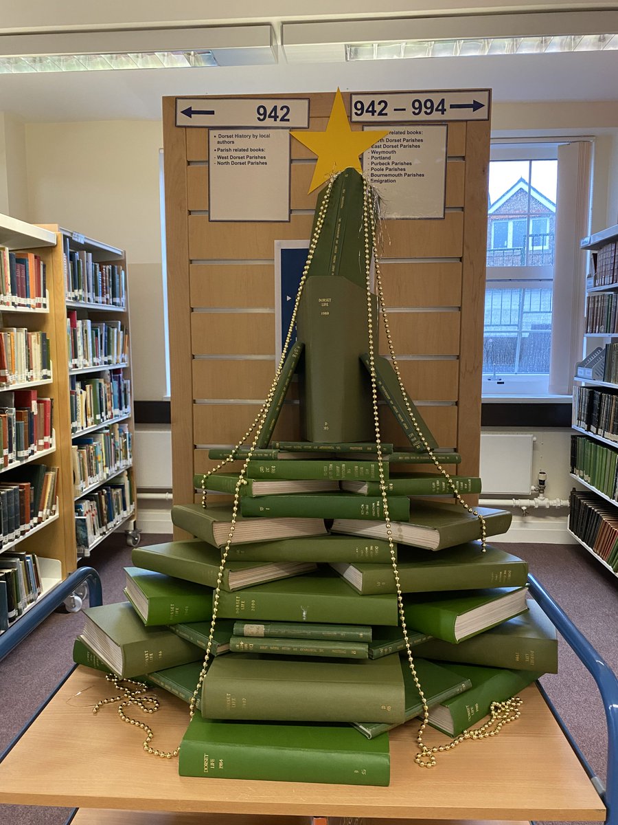 DorsetArchives's tweet photo. #TodayInTheSearchroom... our History Centre assistants are getting into the Christmas spirit! We didn't have a real tree to hand, but green journals work in a pinch🎄 https://t.co/ZJvxcuOhXc