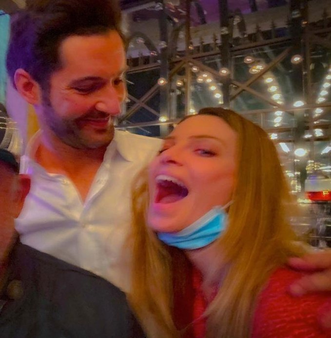 im sure lauren said something that made tom laugh here because look at the progression of the pics he's looking at the camera then looks down laughing then looks at her smiling