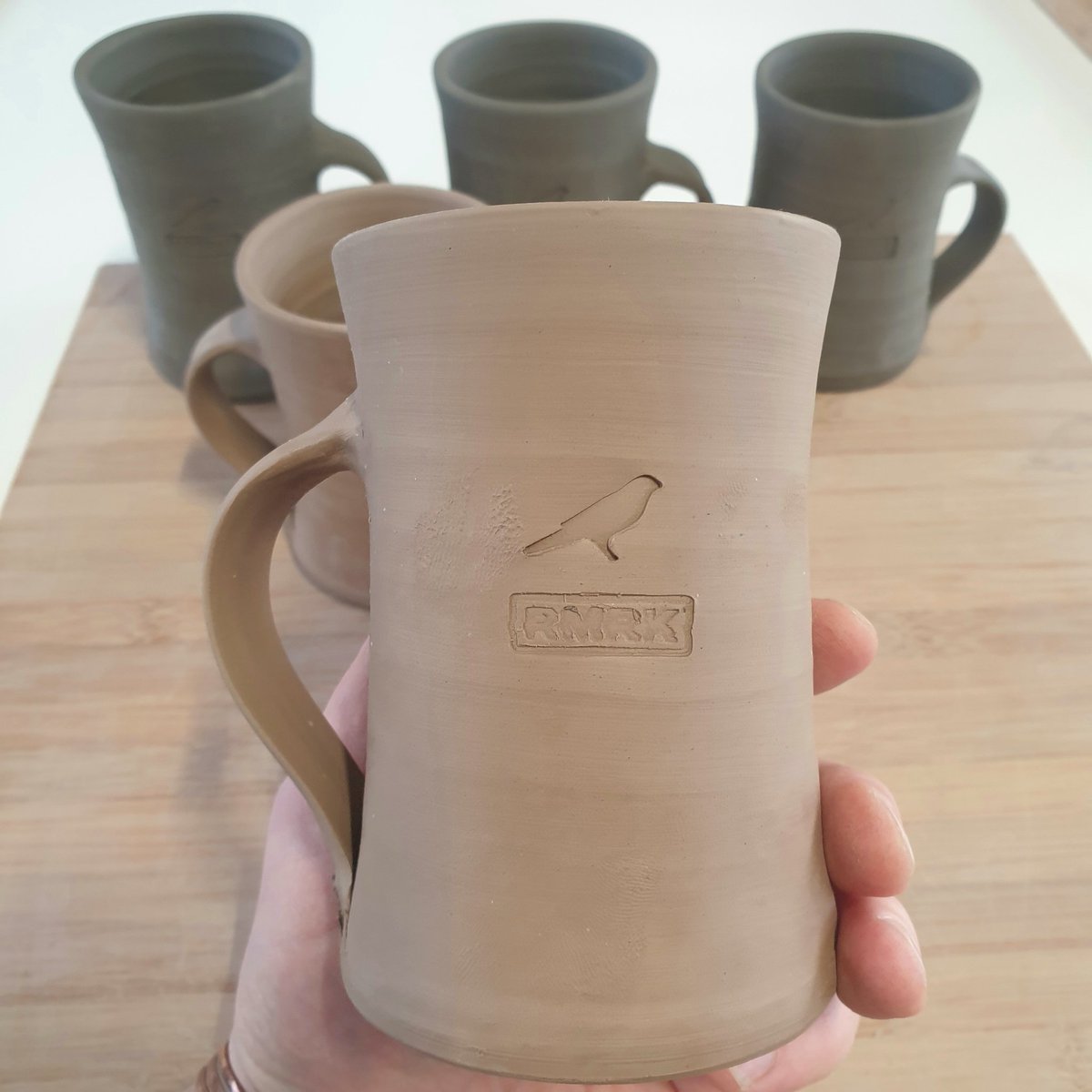 Some freshly stamped #rmrk mugs. These will be fired and accompany a future nft collection 👀🔥🏺 #greenware #cryptopottery $rmrk