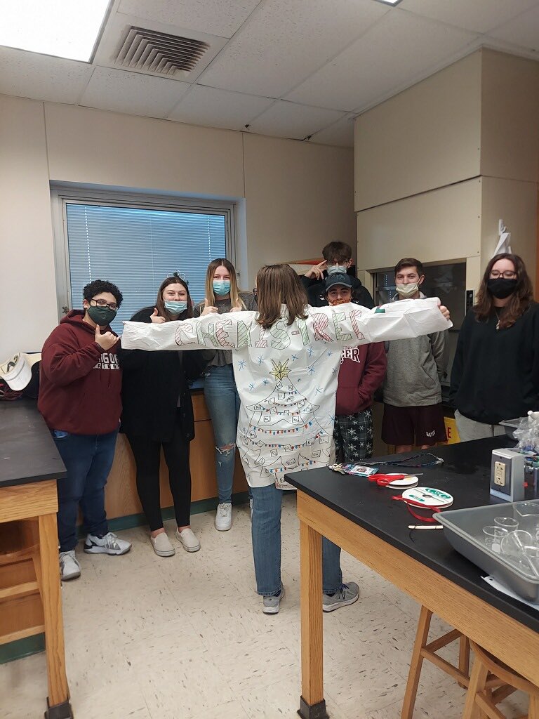 ChemTechTeach's tweet photo. Mrs. Kerr’s Ss designed an awesome Christmas-Character lab coat! #slaterscience #chemistry #UglySweaterDay #labcoats @SlatersBAHS https://t.co/XG7zKqISSX