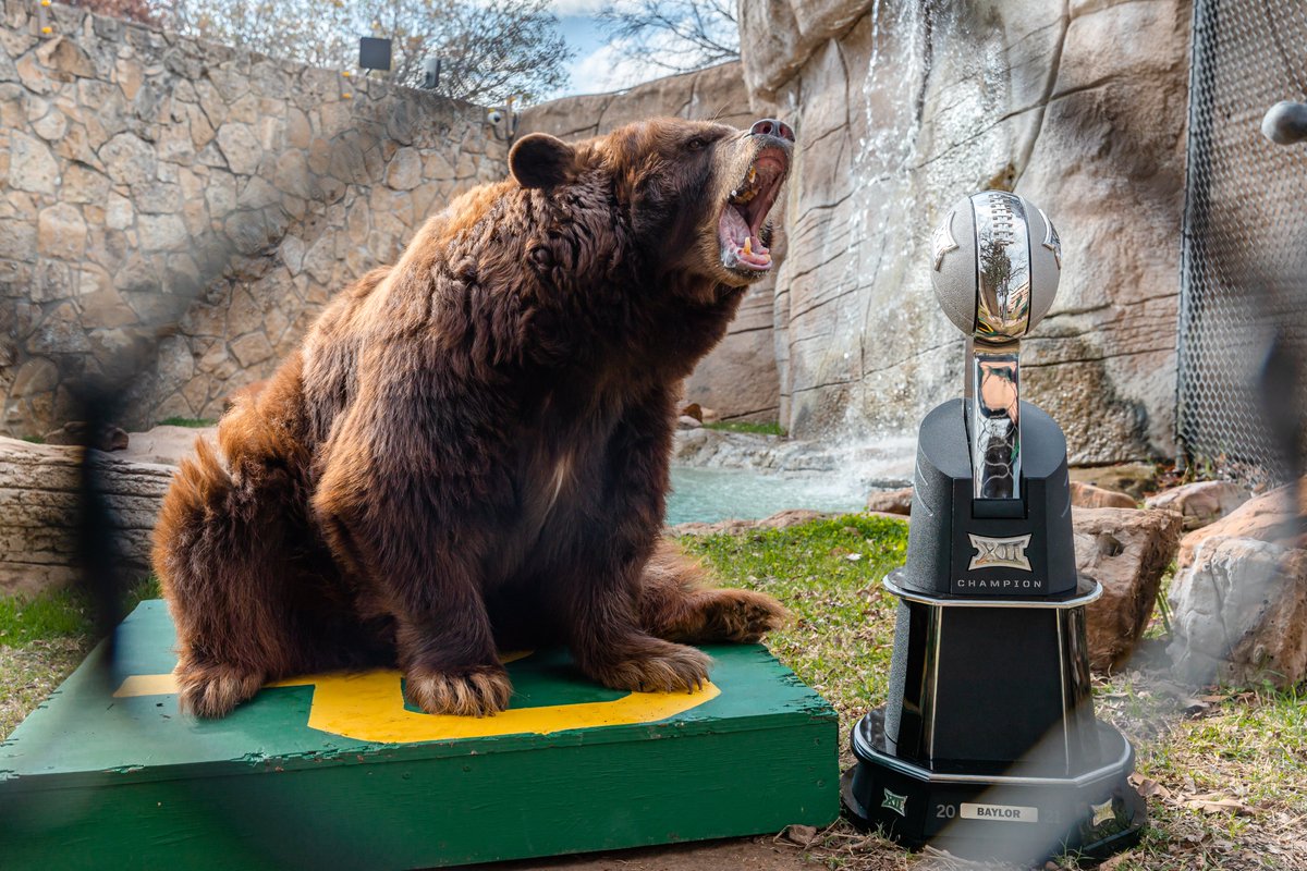 BUFootball's tweet photo. Lady &amp; Joy got to check out the new hardware 🏆 

#SicEm | #BUncommon https://t.co/foDPEp6Da6