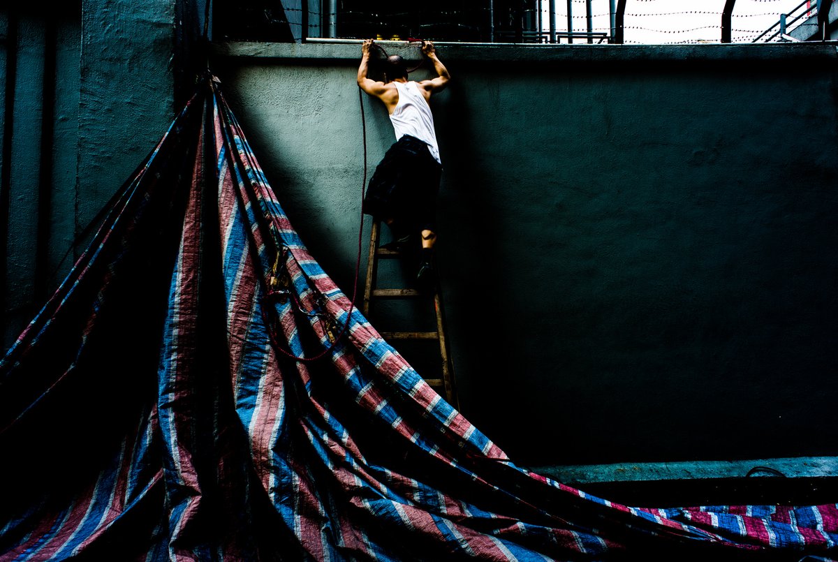 Happy Holidays! We look forward to the brighter new year. We wish you a Merry Christmas and a very Happy New Year! Image: Xyza Cruz Bacani, The Wall in Mong Kok, Hong Kong, 2013. Courtesy the artist.