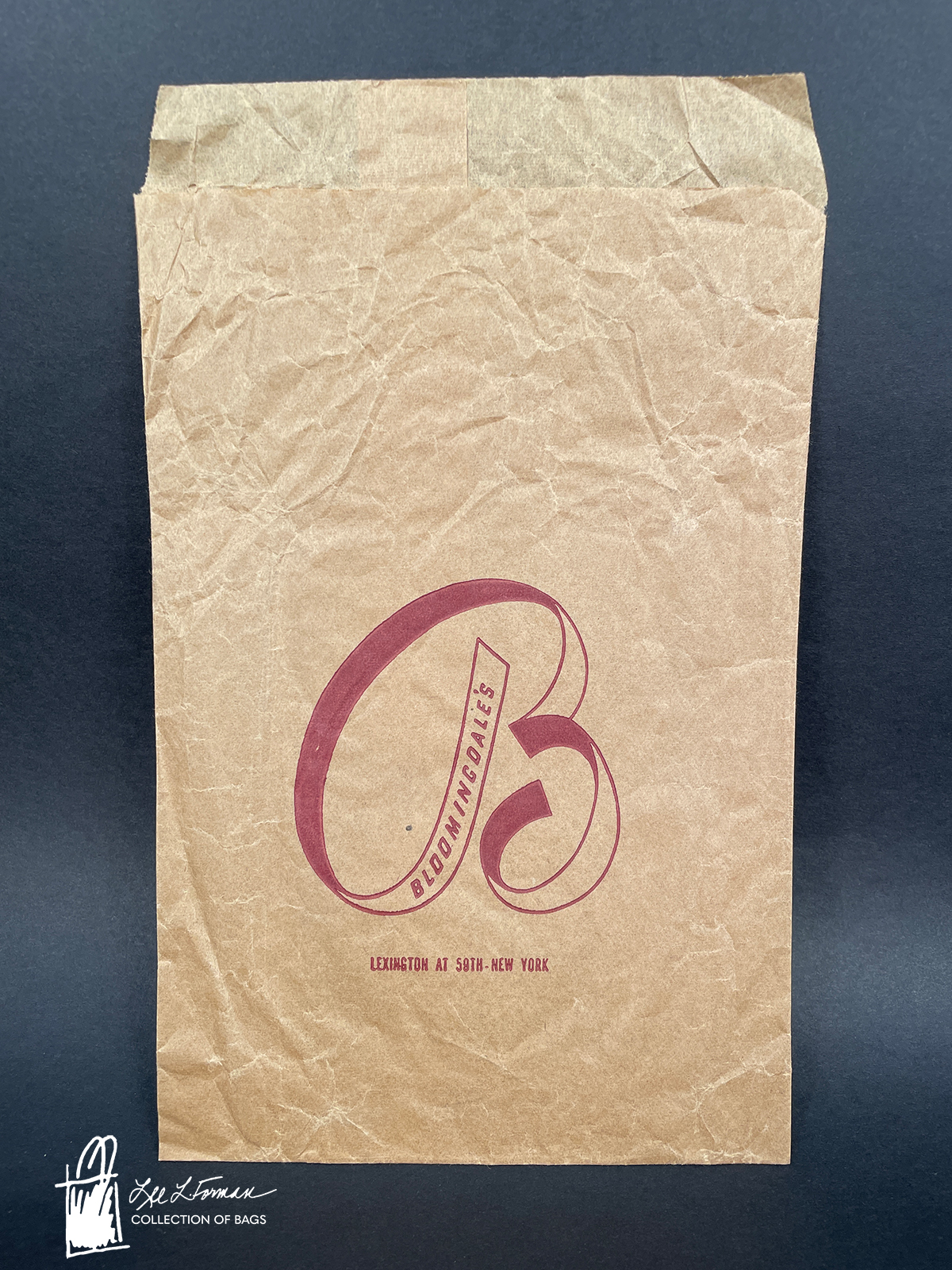 5/365: Lee L. Forman was 21 when she first began collecting bags, initially focusing on Bloomingdale's bags. The oldest among these is a 1950s-era brown paper sleeve featuring a large script 