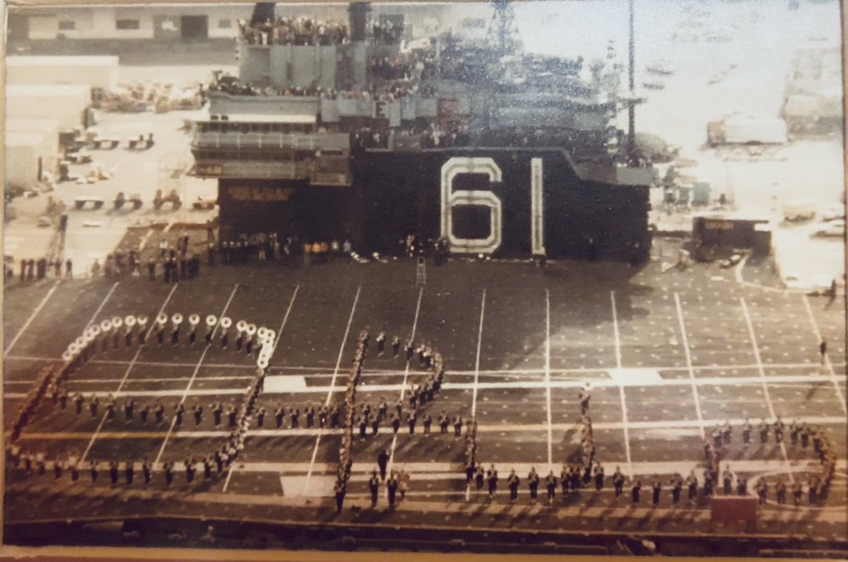 eric_gerstner's tweet photo. @TBDBITLAlumni @TBDBITL The December 17, 1982 Holiday Bowl was a blast, too!  Here is TBDBITL performing Script on the deck of the USS Ranger.  It was not easy laying out a football field on the deck using many rolls of athletic tape. https://t.co/L8LCYcIXCt