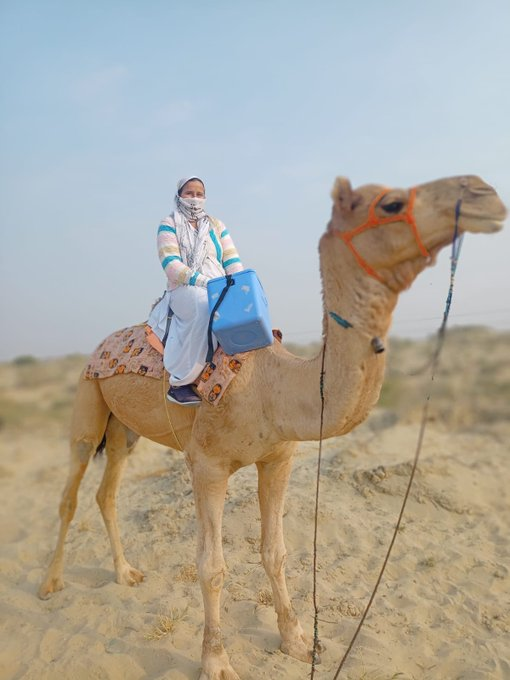 ANI's tweet photo. Rajasthan | A health care worker reaches a village on a camel as part of 'Har Ghar Dastak' vaccination drive, in Barmer 

Pictures shared by Union Health Minister Dr Mansukh Mandaviya. https://t.co/6J4WKAjUsN