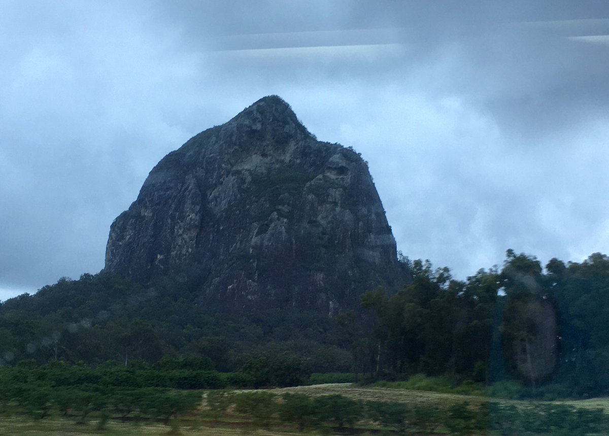 notyouagainDeb's tweet photo. Passing by Mt. Tibrogargan on the way north to visit family for Christmas. Looks a little moody with the storm clouds above. https://t.co/da6Fbw3Xug