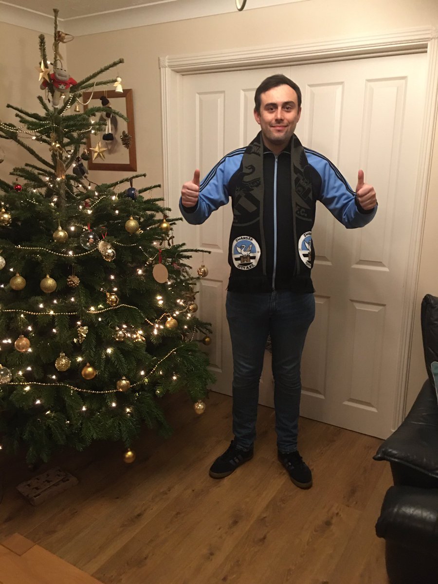 swanstrust's tweet photo. Great to see our Christmas Prize Draw prizes are reaching our members. Hereโs a happy Junior Member Rhodri with his top and Adult member Rhodri with his club scarf. More photos of #HappyJacks to follow. Join the Trust now!
#TogetherStronger #ByTheFansForTheFans https://t.co/vmsMTWM5lI