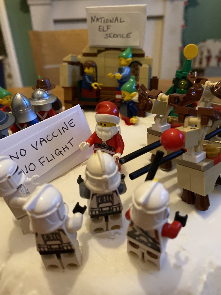 fionaell's tweet photo. Christmas 2021.  Santa is grounded because he didn’t get his second vaccine.   The Elves are running booster clinics. And the stormtroopers think Rudolf looks suspiciously infected and give him a PCR Test.  Merry Christmas everyone. https://t.co/c1o1k6kJ7c