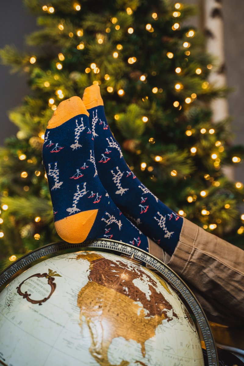 societysocks's tweet photo. Kick your feet up in some fun socks 🧦 Bonus points for almost breaking your Uncle's Vintage Globe at family dinner. Wishing everyone a cozy holiday! https://t.co/bVVwzydKqf