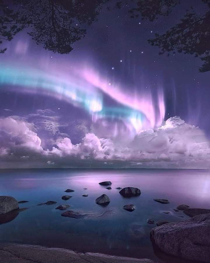 Good morning lovely friends 💜northren Lights dancing above the clouds in Finland