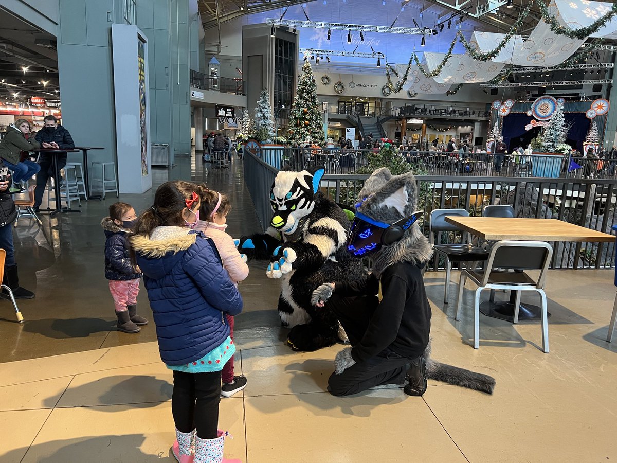 cjrydel's tweet photo. I've had a #FursuitFriday before but this one is special because it was with friends in public! Happy holidays from Oli and pals! #manokit https://t.co/8zbDTPI3HB