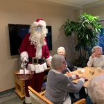 Even Covid can't keep Santa Claus away during our Holiday Happy Hour ... and he brought a furry elf! #santaclaus #furryfriends #thatsnotrudolph #augustinehouse #forbetterretirementliving 