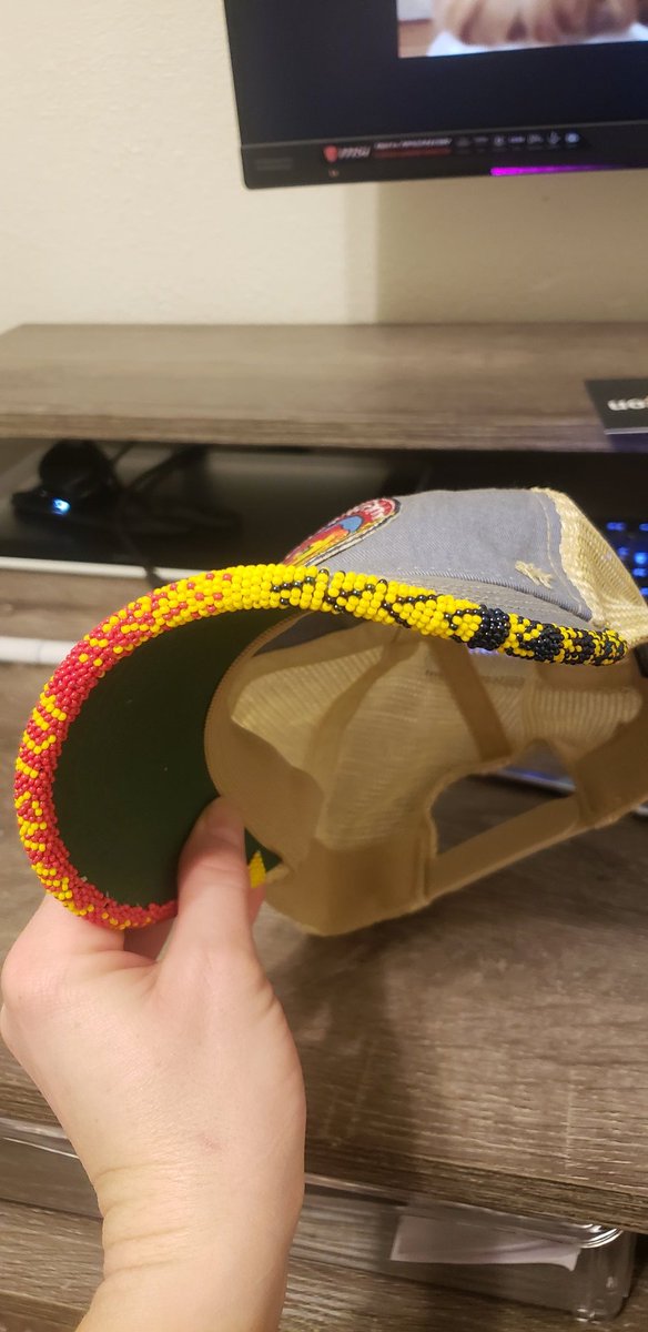 Uncle_Smidge's tweet photo. Effin' A, I just (passably) beaded my first hat brim. No pattern or anything, because wise resource planning is for chumps. Shaky AF but I picked an iffy base hat, so. BEDTIME NOW #LearningExperience #Beading #HRPufnstuf #NativeBeading #AmateurBeading #AuntiesBeading #BeadedHat https://t.co/ik4NQEnFAS