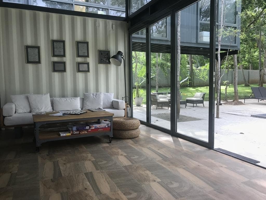 Builderproject_'s tweet photo. In the midst of Satinwood trees is an artistic arrangement of shipping cubes which creates a beautiful living space that both embraces the form of the cubes and breaks down barriers between the indoors and outdoors. https://t.co/jhSgR3DiN6