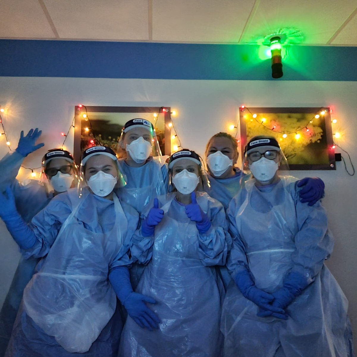 STH_GCCD's tweet photo. Christmas Eve night shift crew in the red zone covid ICU at the Royal Hallamshire in Sheffield. Smiling faces underneath the PPE 🎅🏻🎄❤️ #covidchristmas @SheffieldHosp https://t.co/2flKfbb7PK