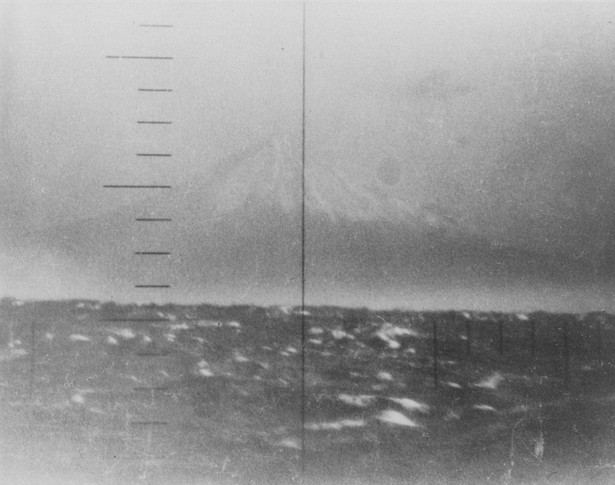NavalInstitute's tweet photo. #OTD in 1943, USS Gurnard (SS-254) snuck into Tokyo Bay where the crew took a photo of Mount Fuji through the periscope. The crew then had Christmas dinner as the Imperial Japanese Navy patrolled above them. Submariners are a different breed. https://t.co/62wt3JFq4u