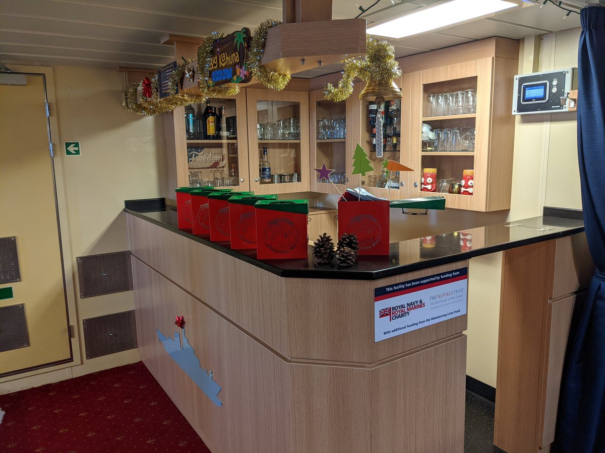 HMS_Spey's tweet photo. Thank you @OpChristmasBox for the amazing ammunition tin! They look great on our amazing bar, funded by @RNRMC during Mess improvements earlier in the year. Thank you both for your support! #Speytacular #DeployedChristmas #Christmas2021 https://t.co/3tMgl3K2CF