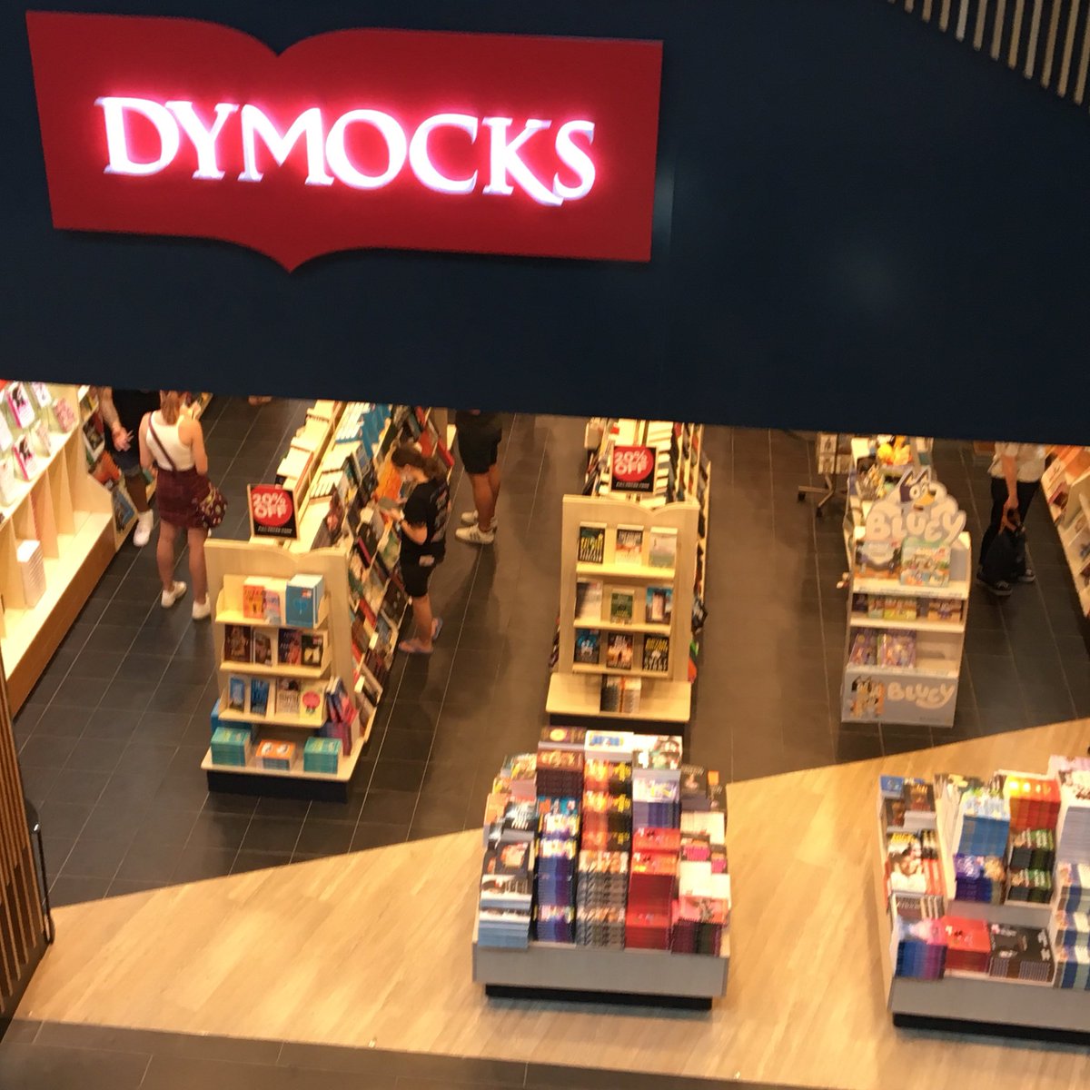 burgewords's tweet photo. While descending into book heaven at @DymocksChermy Brisbane to sign copies of 'Tank Water', I got the same frisson I've always felt when approaching any @DymocksBooks store, with their reassuring red beacons! #longlivebooks https://t.co/jAlSuMQLXd