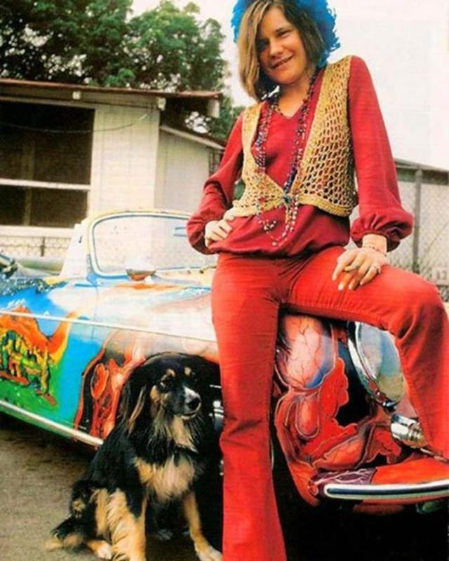 Janis Joplin and her dog pose by her psychedelic 1965 356c Cabriolet Porsche in 1968.